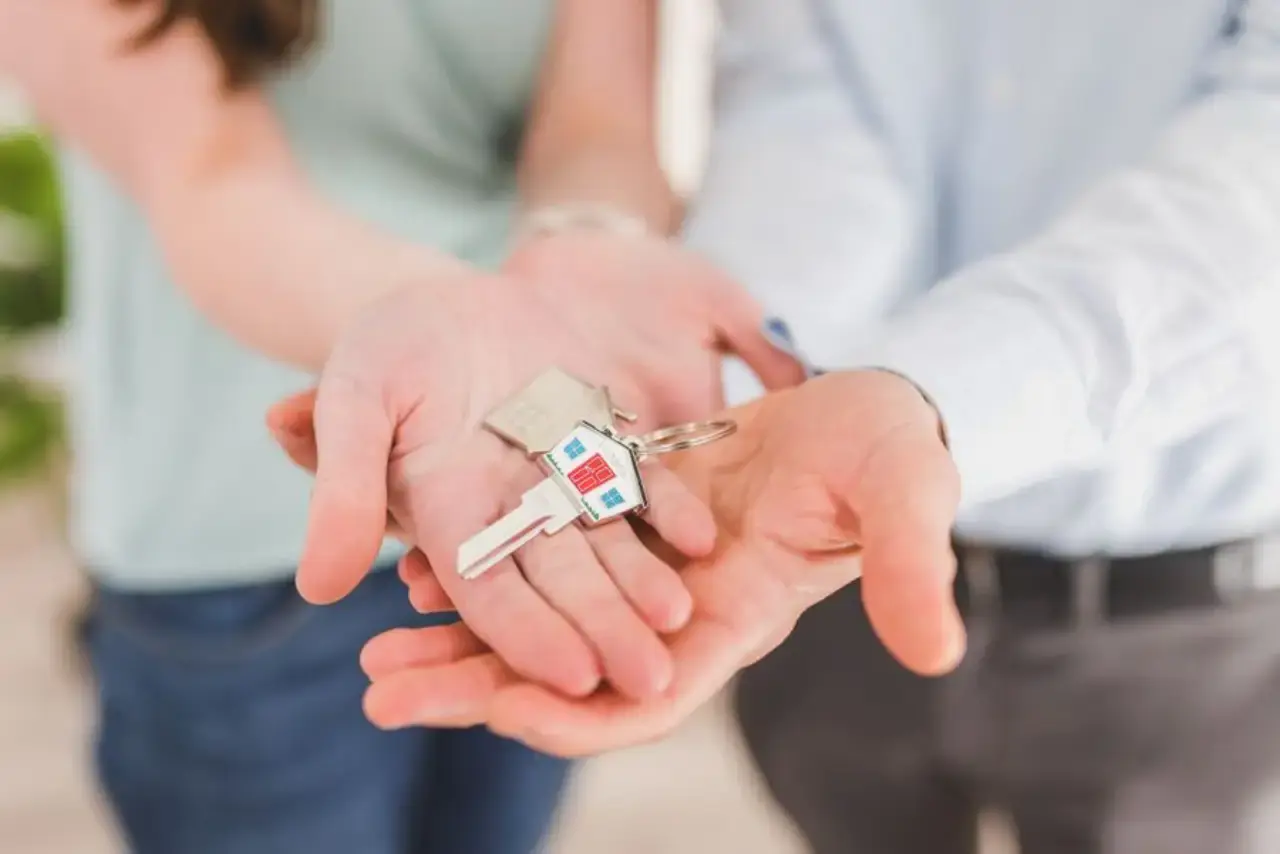 Handing over house keys during a property settlement